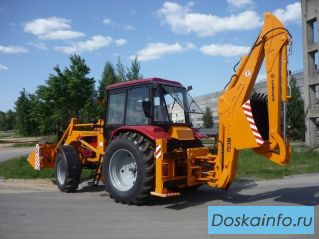 Экскаватор-погрузчик 702ЕМ
